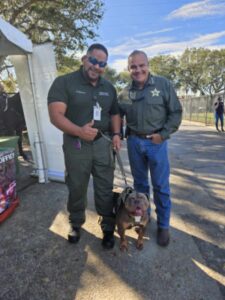 Sheriff Lopez and deputy with a dog